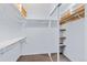 Functional walk-in closet with shelving and ample storage space, ensuring organization at 1273 S Jackson St, Denver, CO 80210