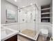 Bathroom with modern shower featuring frameless glass and stylish stone floor, with white subway tile at 724 N Franklin St, Denver, CO 80218