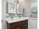 Bathroom with double sink vanity and a view into a shower with white subway tile at 724 N Franklin St, Denver, CO 80218