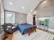 Bedroom with wood floors, pitched ceiling, one window, one chair, and a small bed at 724 N Franklin St, Denver, CO 80218