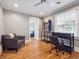 Bedroom featuring hardwood floors, neutral gray walls, and a home office space at 724 N Franklin St, Denver, CO 80218