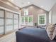 Bedroom features a pitched ceiling, a bed, a closet with sliding doors and windows to the exterior at 724 N Franklin St, Denver, CO 80218