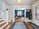 Inviting entryway with hardwood floors and views into a blue dining room at 724 N Franklin St, Denver, CO 80218