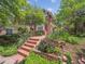 Charming brick home with a well-manicured front yard and inviting red brick stairway at 724 N Franklin St, Denver, CO 80218