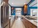 Stylish kitchen features stainless steel appliances, wood cabinets, and an open layout at 724 N Franklin St, Denver, CO 80218