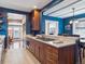 Modern kitchen with custom wood cabinetry, countertops, and stainless steel appliances at 724 N Franklin St, Denver, CO 80218