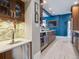 Modern kitchen with a wine fridge, tile backsplash, and stainless steel appliances at 724 N Franklin St, Denver, CO 80218