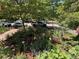 A vibrant garden bed with flowers, mulch, and greenery adds curb appeal to this home's outdoor space at 724 N Franklin St, Denver, CO 80218