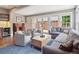Bright living room features comfortable seating and backyard patio access via French doors for seamless indoor-outdoor living at 724 N Franklin St, Denver, CO 80218