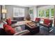 Comfortable living room featuring hardwood floors, large windows, stylish furniture and access to outdoor patio at 724 N Franklin St, Denver, CO 80218