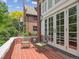 Outdoor patio featuring brick flooring, seating, and French doors leading indoors at 724 N Franklin St, Denver, CO 80218