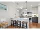 A modern kitchen with stainless steel appliances, gray cabinets, and a white quartz countertop at 1234 N Tennyson St, Denver, CO 80204