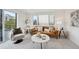 Bright living room with sliding glass doors, carpet, and stylish furnishings, creating an inviting living space at 1234 N Tennyson St, Denver, CO 80204