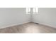 Bedroom featuring light, airy space with laminate flooring at 1225 S Xavier St, Denver, CO 80219