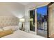 Bedroom with city views and private balcony access at 1827 N Grant St # 1000, Denver, CO 80203