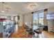 Bright dining room with hardwood floors, glass table, and city views at 1827 N Grant St # 1000, Denver, CO 80203