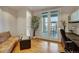 Home office with balcony access and hardwood floors at 1827 N Grant St # 1000, Denver, CO 80203