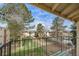 Apartment balcony with view to trees and parking lot at 12113 Melody Dr # 304, Denver, CO 80234