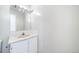 Bathroom features a sink with cabinets and large mirror at 12113 Melody Dr # 304, Denver, CO 80234