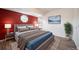 Tastefully decorated bedroom with carpet, lots of natural light, and a large decorative painting at 12113 Melody Dr # 304, Denver, CO 80234