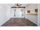 Bright dining area features new wood flooring, a ceiling fan, and an open concept at 12113 Melody Dr # 304, Denver, CO 80234