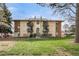 A charming two-story apartment building featuring multiple balconies and an inviting facade at 12113 Melody Dr # 304, Denver, CO 80234
