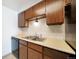 Compact kitchen with plenty of cabinets and a dishwasher at 12113 Melody Dr # 304, Denver, CO 80234