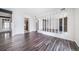 Bright living room featuring sleek flooring and stylish mirrored wall accents at 12113 Melody Dr # 304, Denver, CO 80234