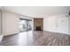 A view of the Living Room with a stone fireplace and balcony access at 12113 Melody Dr # 304, Denver, CO 80234