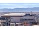 View of Ball Arena and the city skyline, showcasing nearby mountains and residential areas at 1700 Bassett St # 1321, Denver, CO 80202