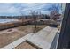 Spacious backyard with patio, fire pit, beautiful landscaping, and lake views at 4328 S Carr Ct, Littleton, CO 80123