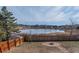 Spacious backyard features a lovely fire pit area and scenic pond views at 4328 S Carr Ct, Littleton, CO 80123