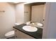 Chic bathroom with dark countertops, gold fixtures, and modern finishes at 4328 S Carr Ct, Littleton, CO 80123