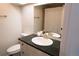 Bright bathroom featuring a shower-tub combo and a single sink vanity with gold hardware at 4328 S Carr Ct, Littleton, CO 80123