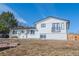 Beautiful white brick home with a balcony, modern architecture, and spacious outdoor area at 4328 S Carr Ct, Littleton, CO 80123