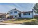 Charming two-story home with a well-maintained lawn and inviting curb appeal at 4328 S Carr Ct, Littleton, CO 80123