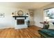 Cozy fireplace with an elegant mirror and sconce lighting at 4328 S Carr Ct, Littleton, CO 80123