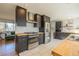 Modern kitchen equipped with stainless steel appliances, sleek cabinets, and butcher block countertops at 4328 S Carr Ct, Littleton, CO 80123