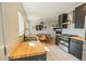 Open concept kitchen with wooden counters, stainless steel appliances, and an adjacent dining area at 4328 S Carr Ct, Littleton, CO 80123