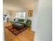Inviting living space with hardwood floors, green sofa, and stylish accents at 4328 S Carr Ct, Littleton, CO 80123