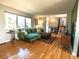 Bright living room showcases hardwood floors, a large window, and modern furnishings at 4328 S Carr Ct, Littleton, CO 80123