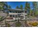 Spacious backyard with a patio, bar area, and water feature, ideal for outdoor enjoyment at 1410 Old Sequoia Ct, Franktown, CO 80116