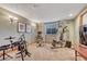Basement gym featuring exercise equipment, weights, and natural light at 1410 Old Sequoia Ct, Franktown, CO 80116