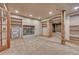 Finished carpeted basement with a decorative fireplace and built-in shelves at 1410 Old Sequoia Ct, Franktown, CO 80116