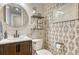 Charming powder room with modern fixtures, stylish wallpaper, and shiplap accent wall at 1410 Old Sequoia Ct, Franktown, CO 80116