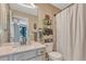 Bright bathroom featuring a modern vanity, toilet, and shower with stylish accents at 1410 Old Sequoia Ct, Franktown, CO 80116