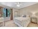 Bedroom featuring bright light, furniture, floral curtains, and carpet flooring at 1410 Old Sequoia Ct, Franktown, CO 80116