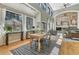 Open concept dining room featuring vaulted ceilings, and large windows with natural light at 1410 Old Sequoia Ct, Franktown, CO 80116