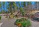 Beautifully landscaped garden area with a serene waterfall feature at 1410 Old Sequoia Ct, Franktown, CO 80116
