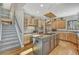 Traditional kitchen with wood cabinets, center island, granite countertops, and hardwood floors at 1410 Old Sequoia Ct, Franktown, CO 80116